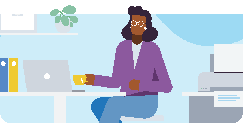 A bookkeeper at a desk with a coffee cup and a laptop