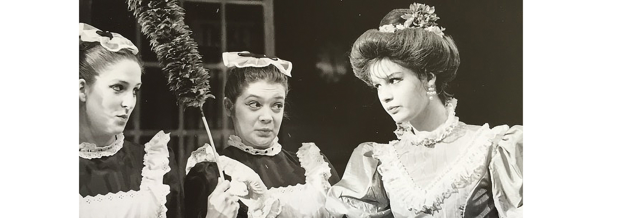 Black and white photo of Melanie in a ballet production dressed as Aunt Polly.