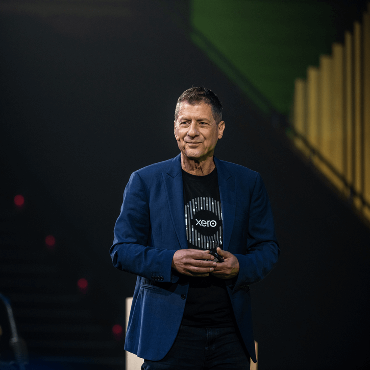 A member of the Xero leadership team speaks to a large gathering of Xero staff.