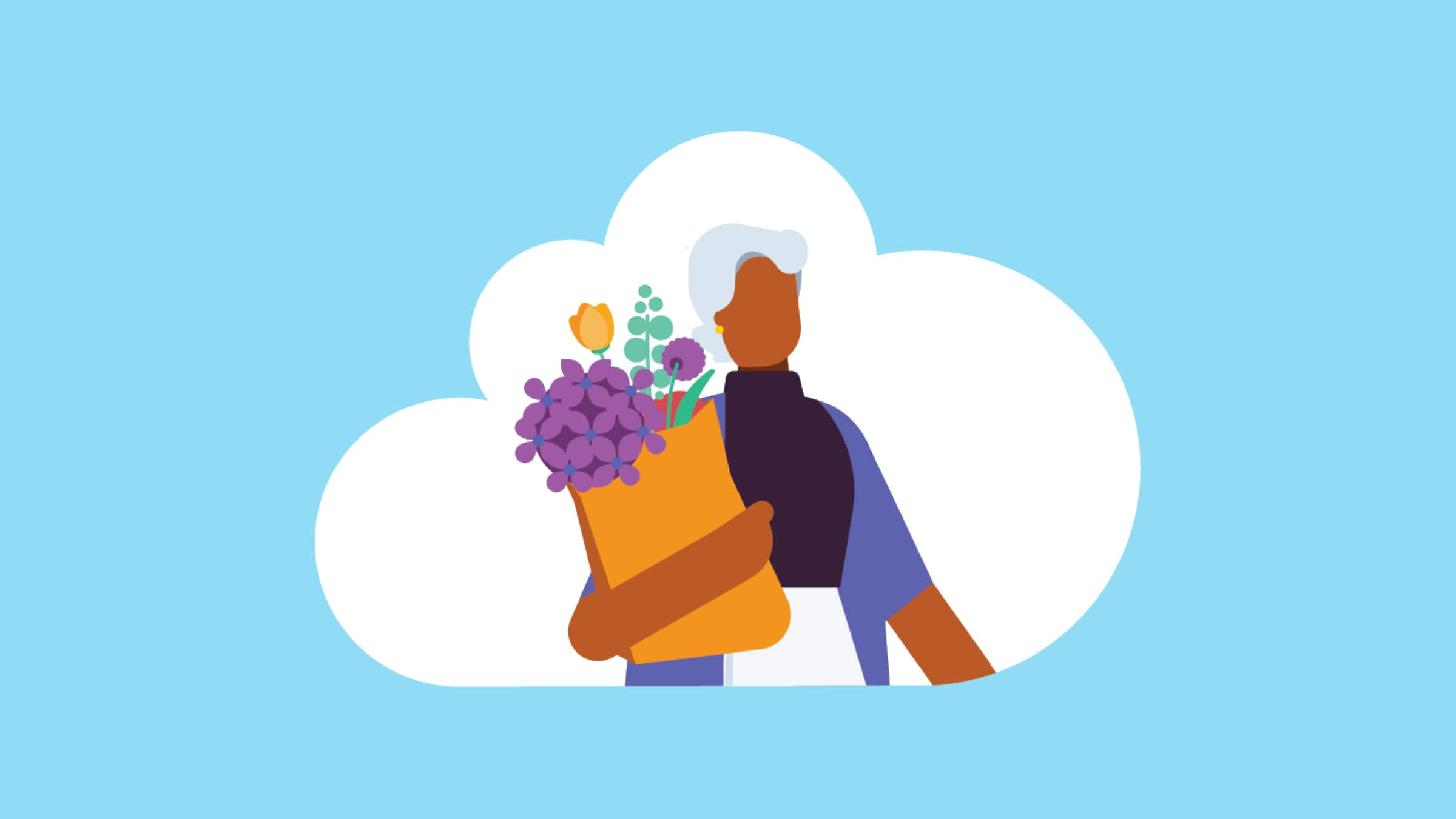 A shopper carries flowers bought from a market in a brown paper bag.