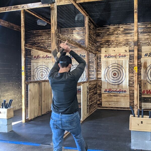axe-throwing is a natural cousin of darts and bowling