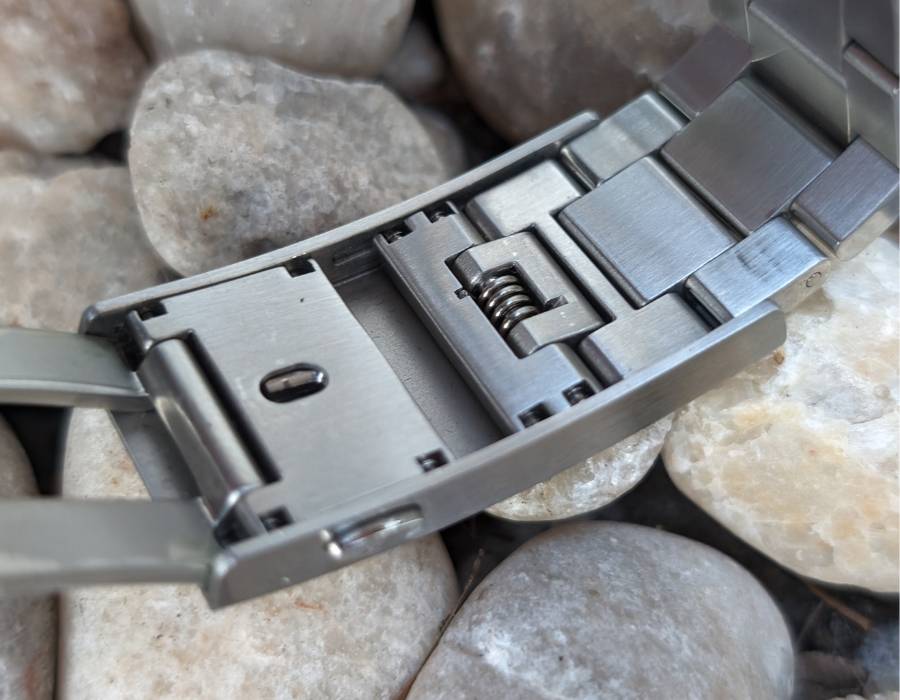 Close-up of WISE ADX 110 True GMT stainless steel bracelet and clasp mechanism